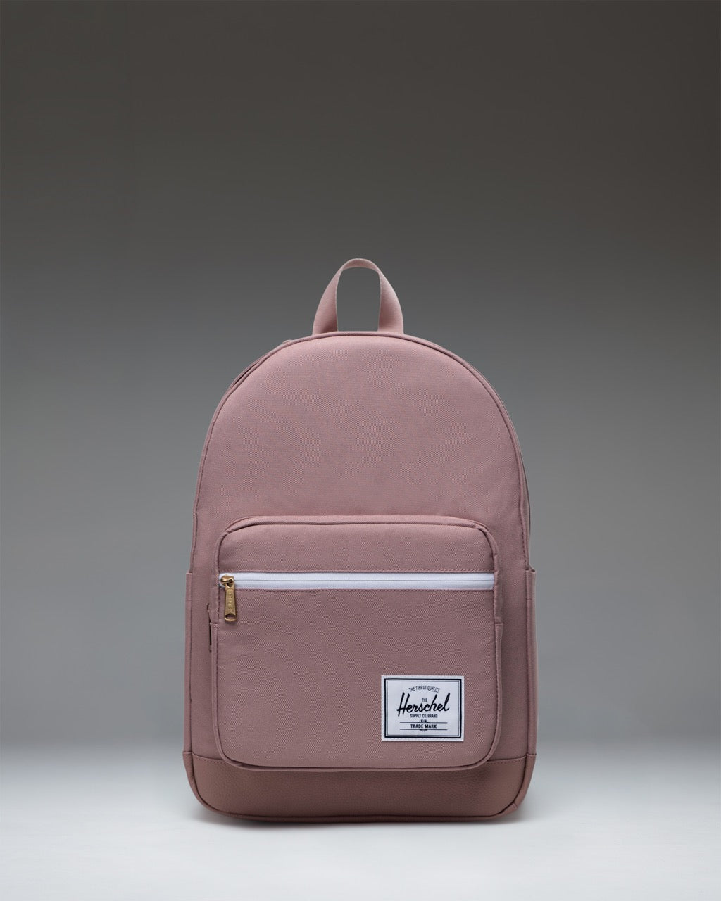 Herschel Supply Co. Pop Quiz Backpack in Ash Rose pink, featuring a front pocket and the classic white logo label.