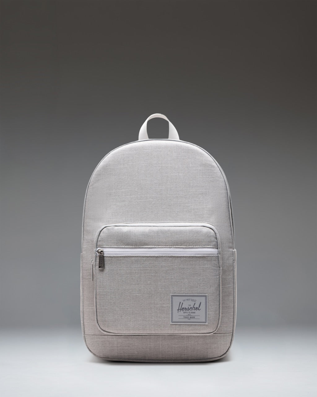 Herschel Supply Co. Pop Quiz Backpack in Grey Crosshatch, showing the front view with a brown zipper detail and a white logo patch.