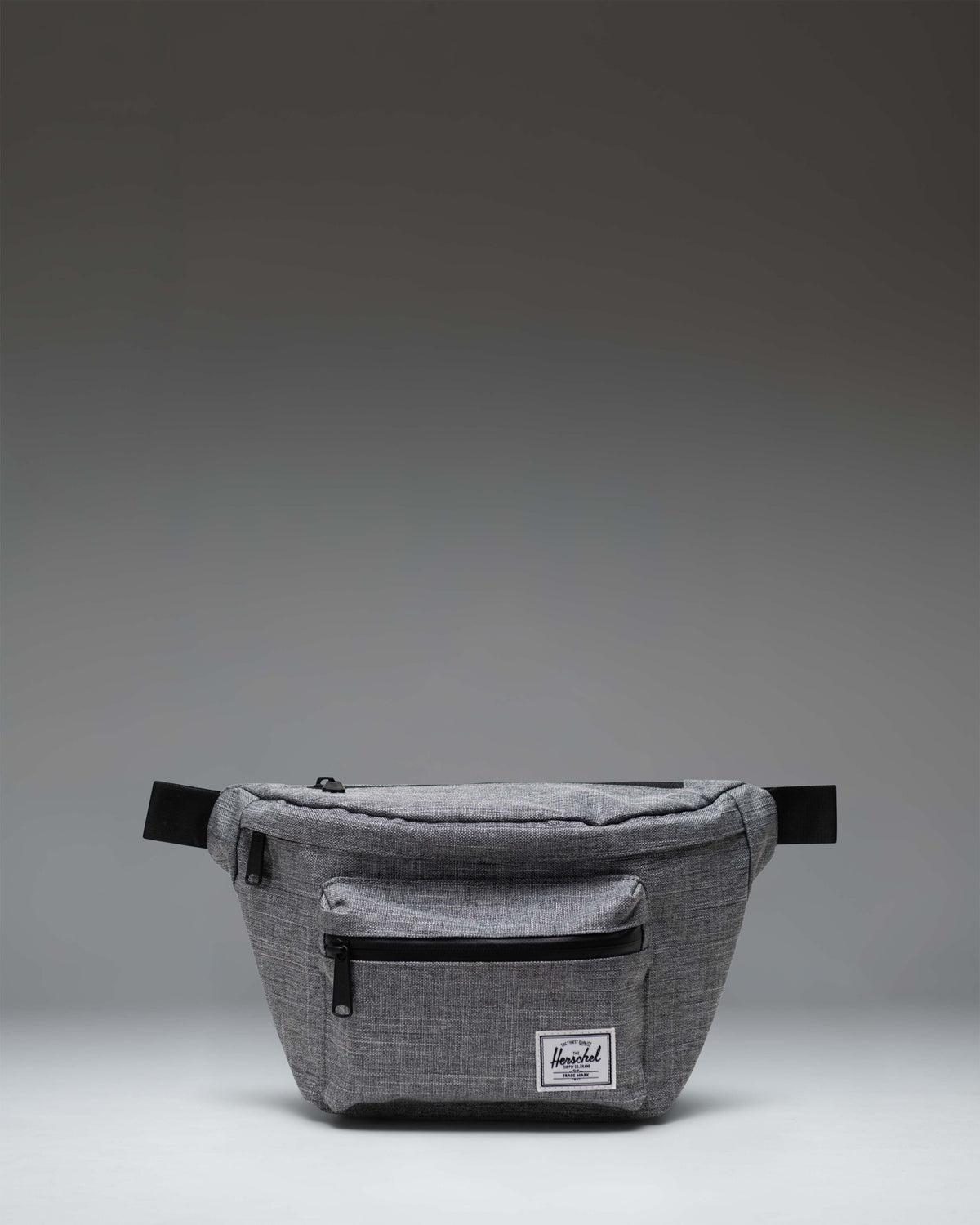 Herschel Supply Co Pop Quiz Hip Pack in Raven Crosshatch grey, featuring a front pocket with a waterproof zipper and a classic woven label.