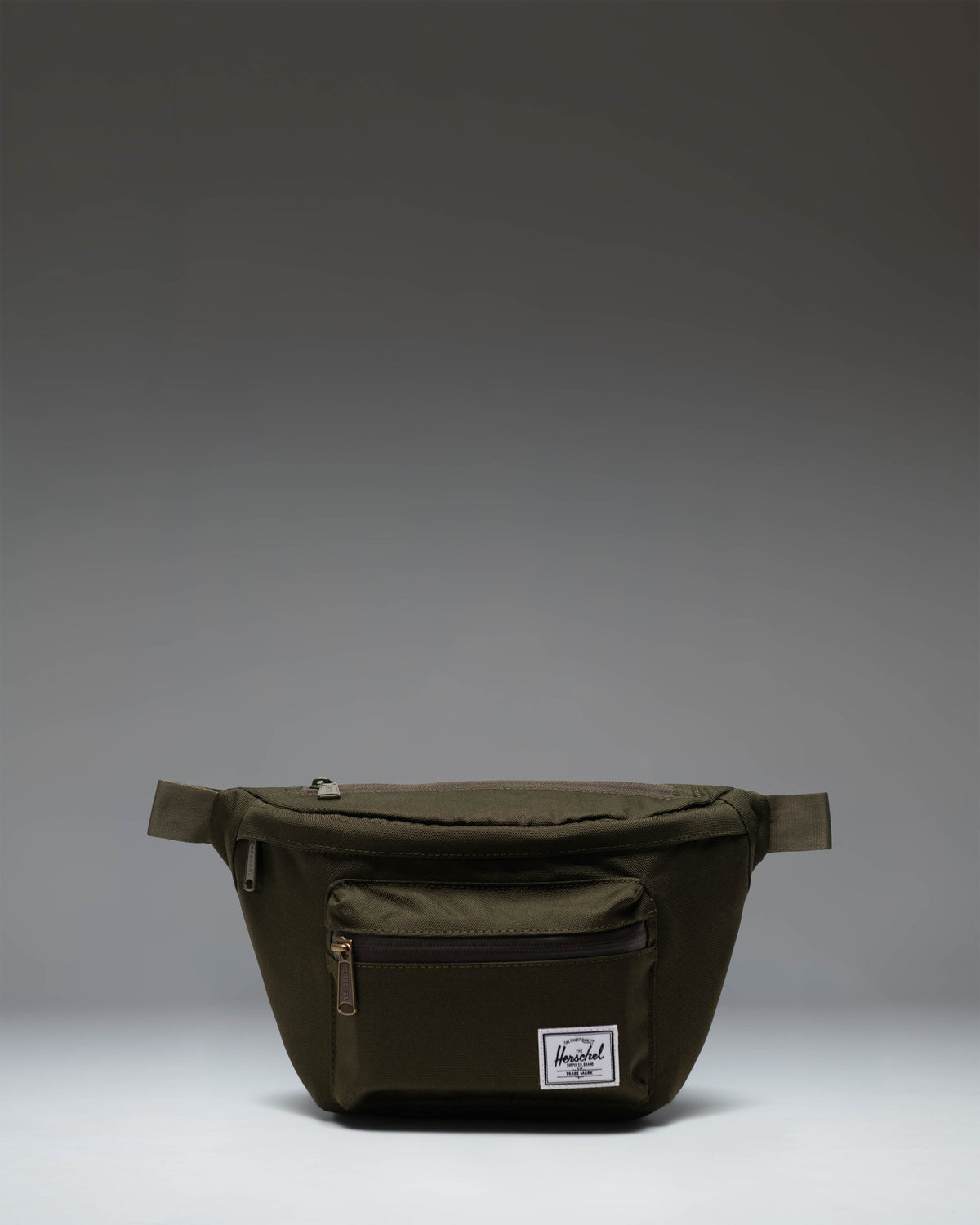 Herschel Supply Co. Pop Quiz Hip Pack in Ivy Green, showing the front view of the compact waist bag with a clean, classic design.