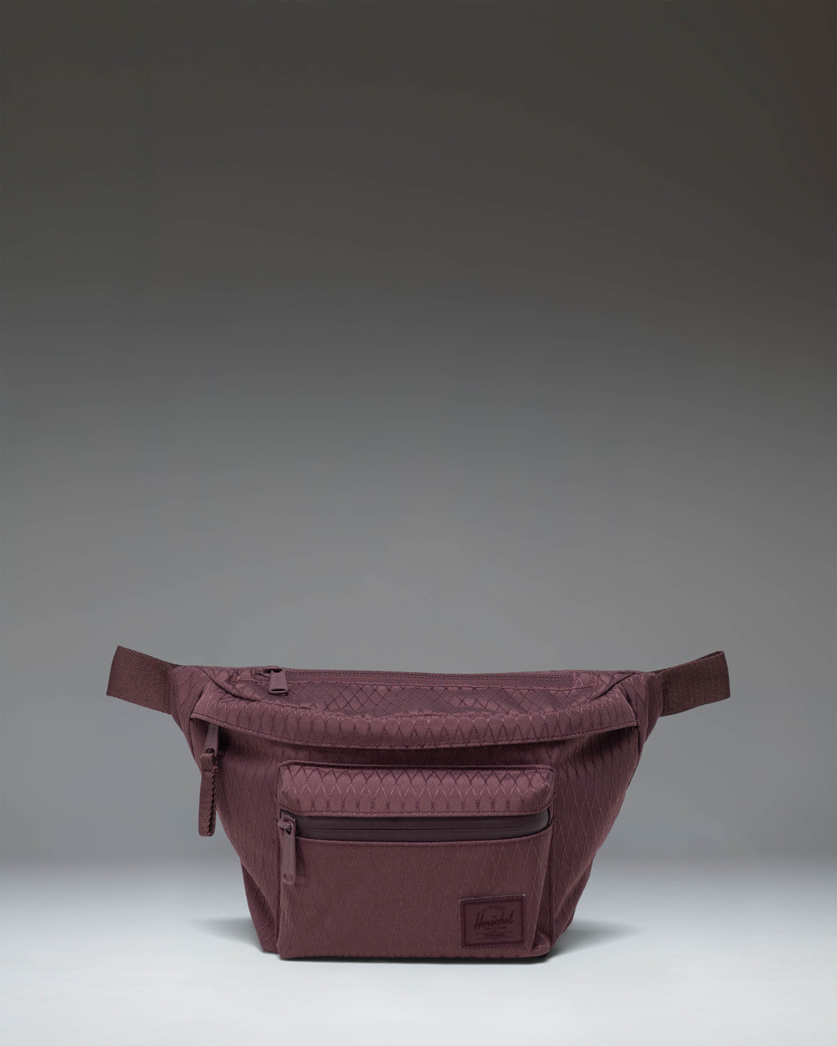 Herschel Supply Co. Pop Quiz Hip Pack in the Huckleberry Diamond pattern, featuring a blue and white geometric design.
