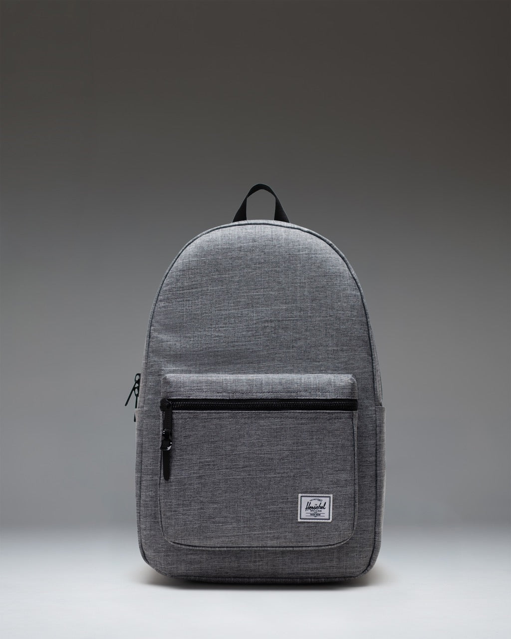 Herschel Supply Co. Settlement Backpack in Raven Crosshatch, showing a front view of the grey heathered fabric and black zipper details.