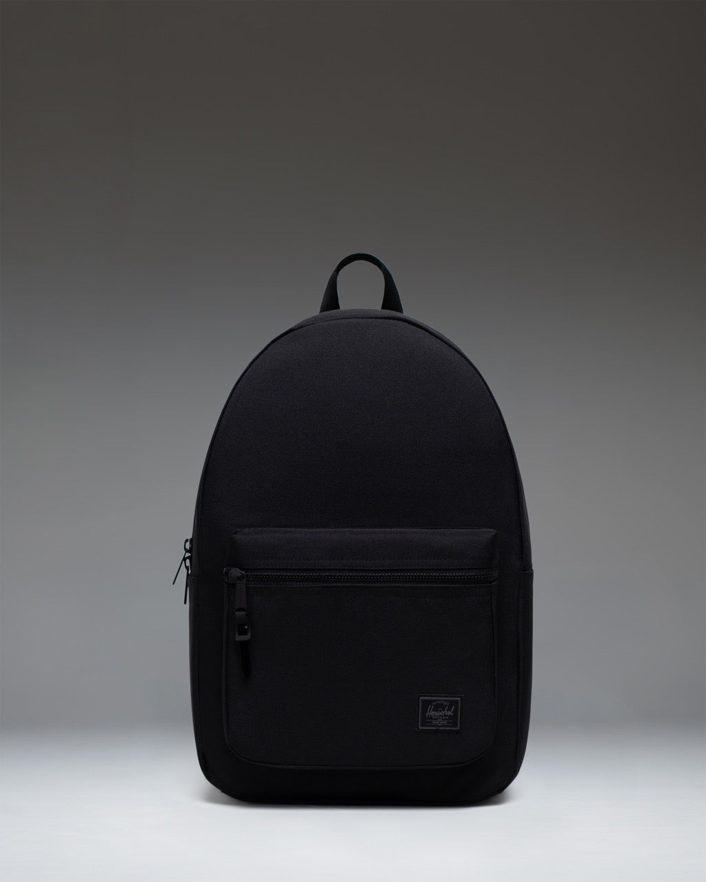 Front view of the Herschel Supply Co. Settlement Backpack in Black Tonal, showcasing its classic silhouette and clean design.