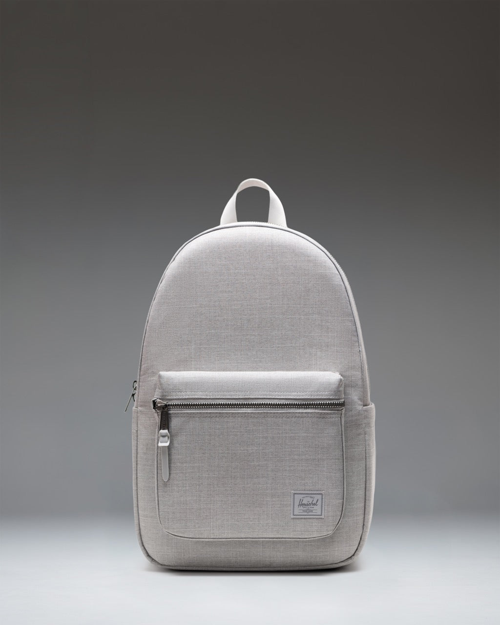 Herschel Supply Co. Settlement Backpack in Grey Crosshatch showing the classic design with a front pocket and exposed zippers.