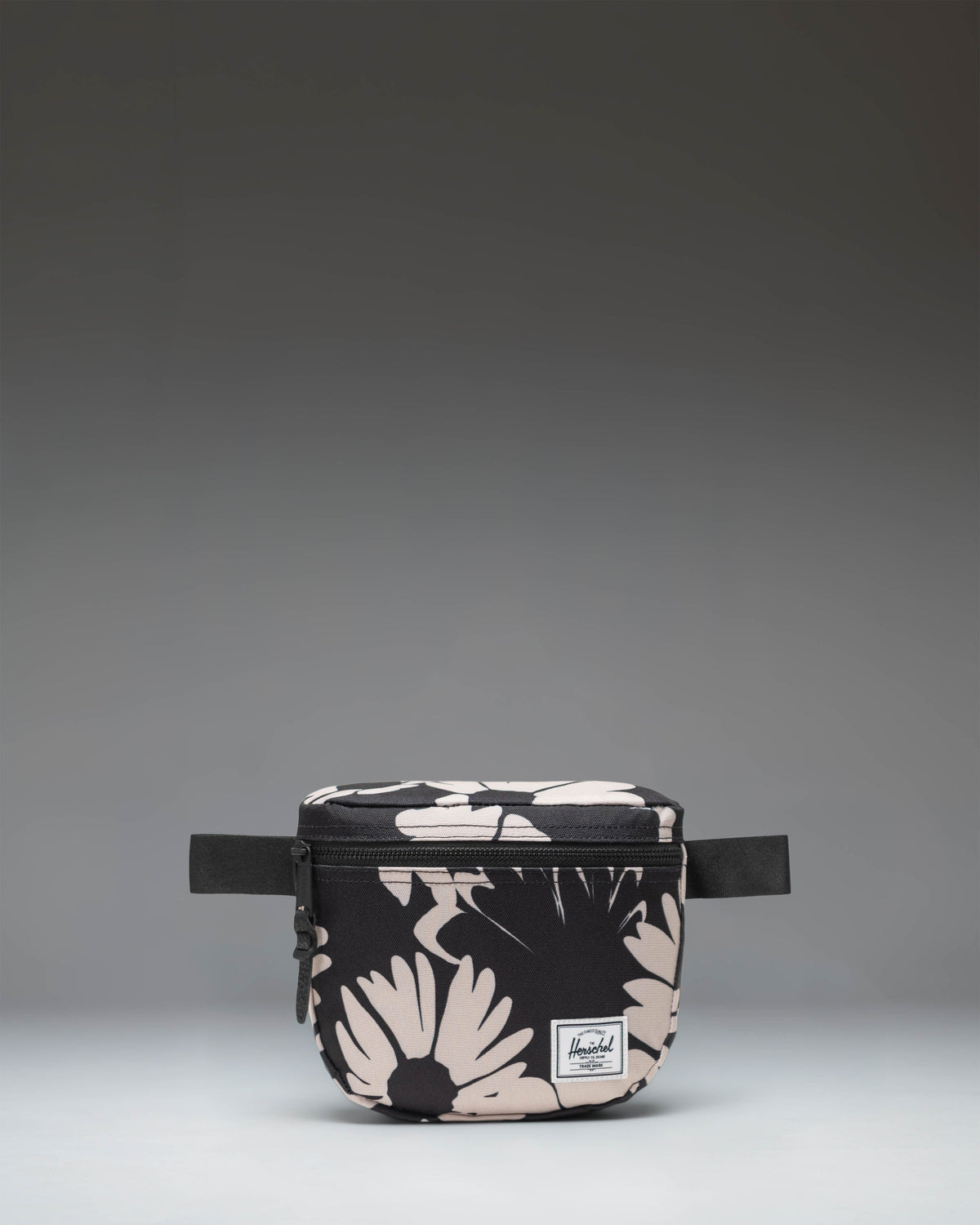 Herschel Supply Co. Settlement Hip Pack in Graphic Daisy - Moonbeam, featuring a black floral pattern on an off-white background.