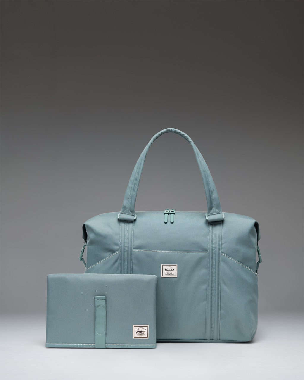 Herschel Supply Co. Strand Duffle Diaper Bag size guide chart. Dimensions: 14.25 inches (H) x 17 inches (W) x 5.5 inches (D), 24L.