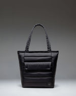 Black Herschel Retreat Tote bag shown from the front against a white background.