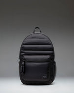 Herschel Supply Co. Settlement Backpack in black, showing the classic design with a front pocket and exposed zippers.