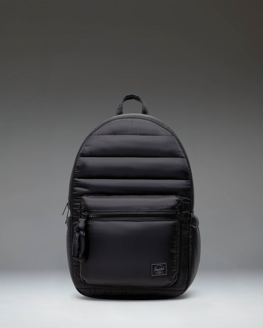 Herschel Supply Co. Settlement Backpack in black, showing the classic design with a front pocket and exposed zippers.
