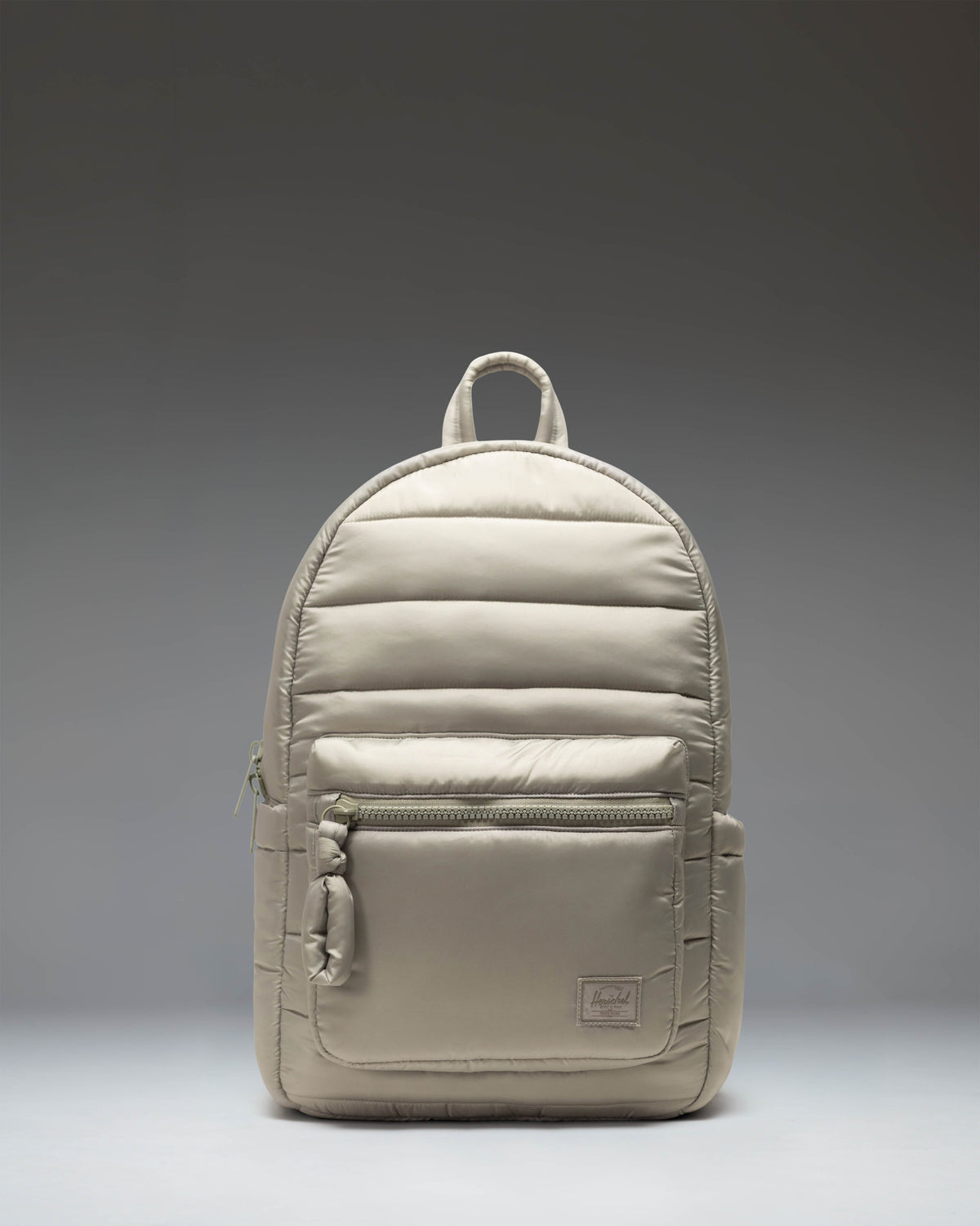 Herschel Supply Co. Settlement Backpack in Abbey Stone, featuring a front storage pocket and classic woven label.