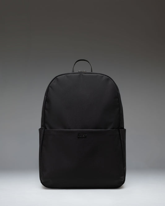 Herschel Supply Co. Beatrix Backpack in black, showing the front view with classic straps, zippers, and signature logo patch.
