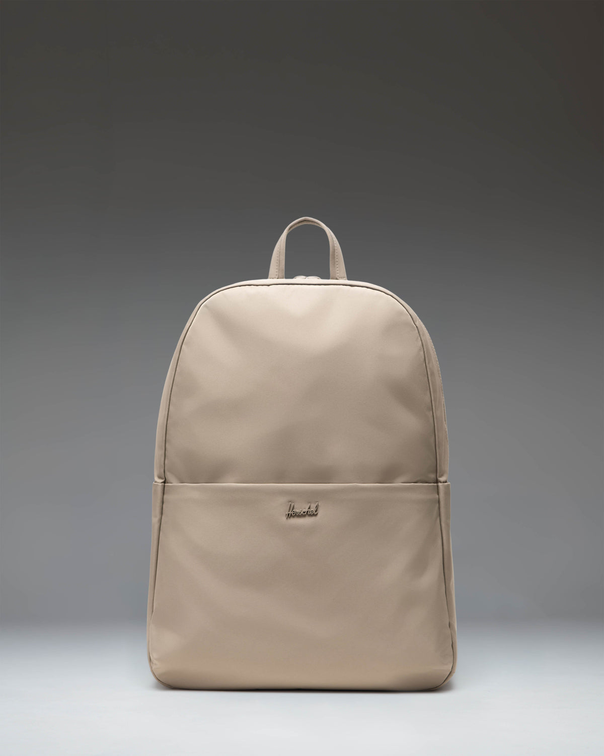 Herschel Supply Co. Beatrix Backpack in Vintage Khaki, showing a front view of the tan backpack with shoulder straps.