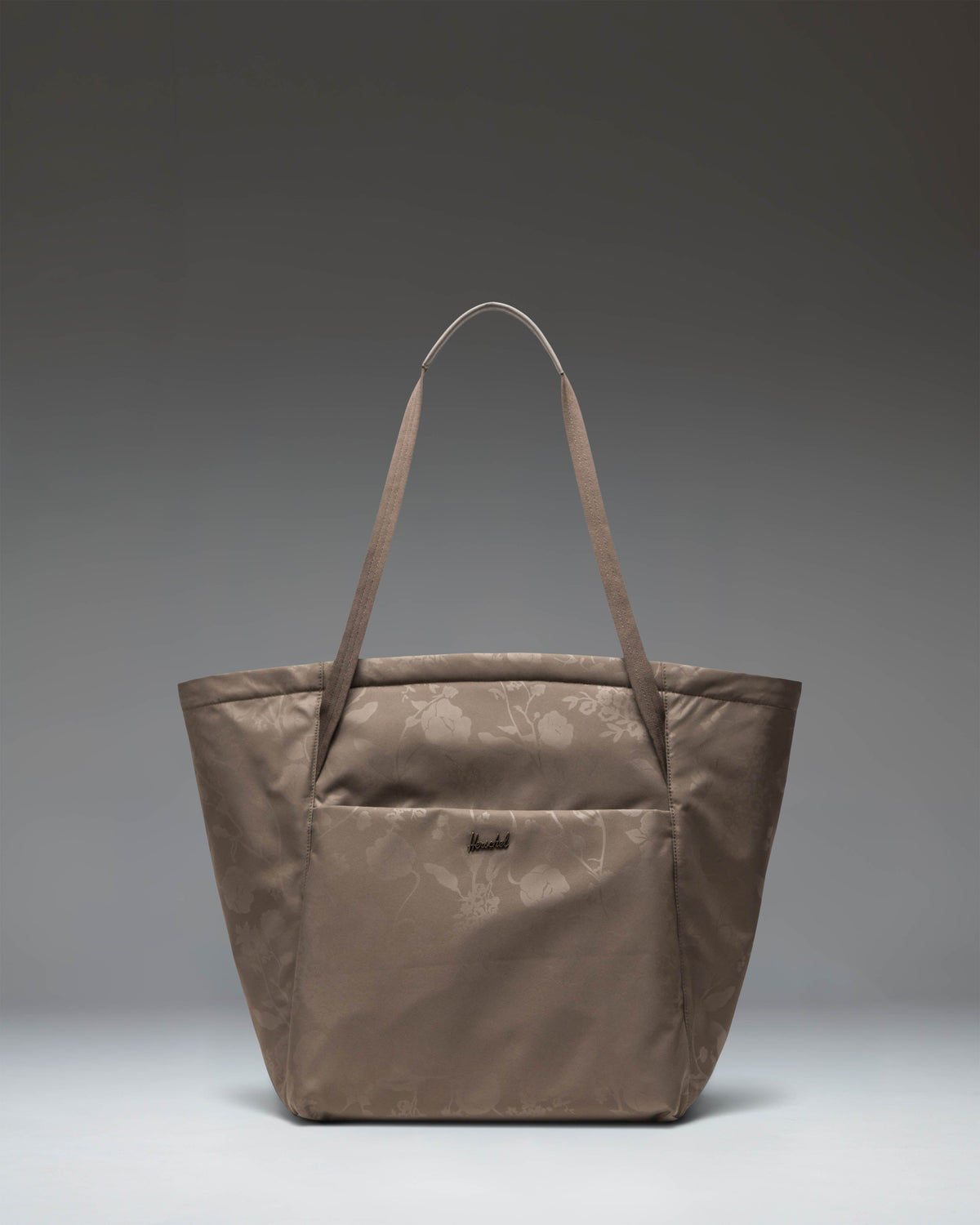Herschel Supply Co. Joana Tote in Trailing Floral Heat Emboss, showing the spacious interior and stylish floral pattern.