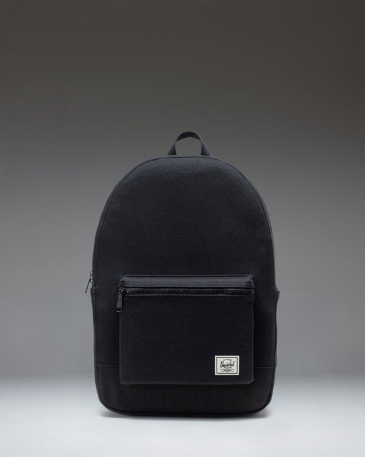 Front view of the Herschel Supply Co. Pacific Daypack in black, featuring a clean, classic backpack design with zippered compartments.