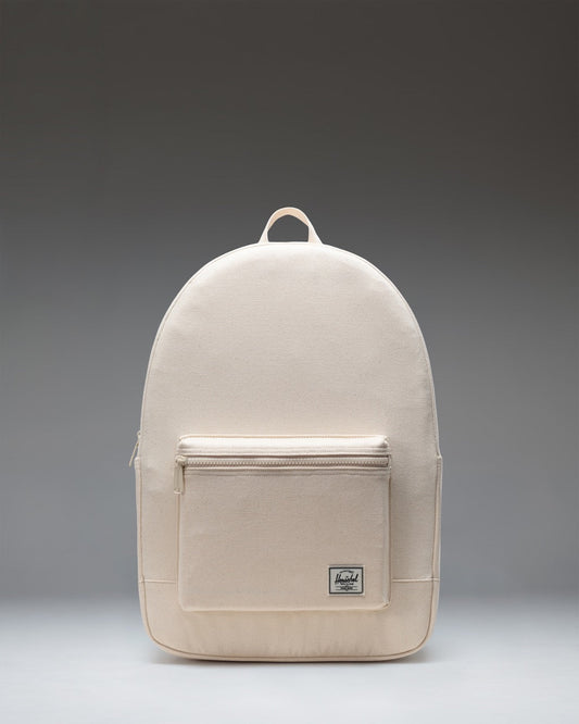 Herschel Supply Co. Pacific Daypack in Natural, showing a clean, minimalistic design with adjustable shoulder straps and a front zippered pocket.