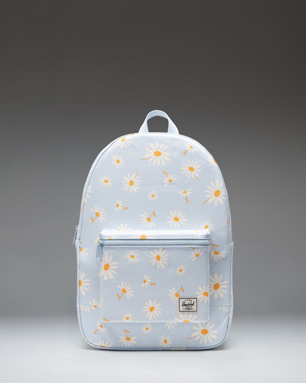 Herschel Pacific Daypack in Wild Daisy Skyway, featuring a blue floral canvas pattern with adjustable straps and front pocket.