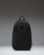 Herschel Seymour Backpack in black, showing the front view with dual straps, a front zippered pocket, and the classic Herschel woven label.
