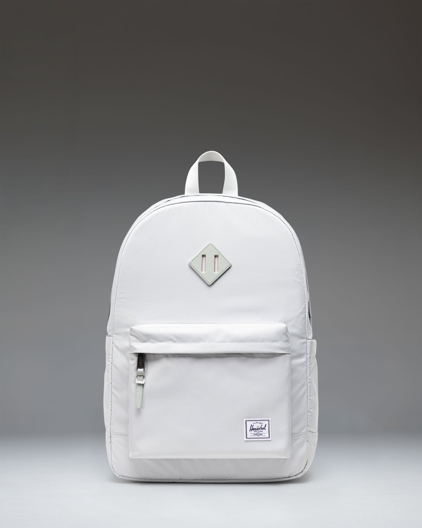 Herschel Heritage Backpack in Metal gray featuring a front storage pocket and classic woven label.