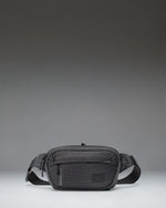 Herschel Supply Co Ultralight Hip Pack 2 L in Black shown from the front highlighting its lightweight design and adjustable strap.