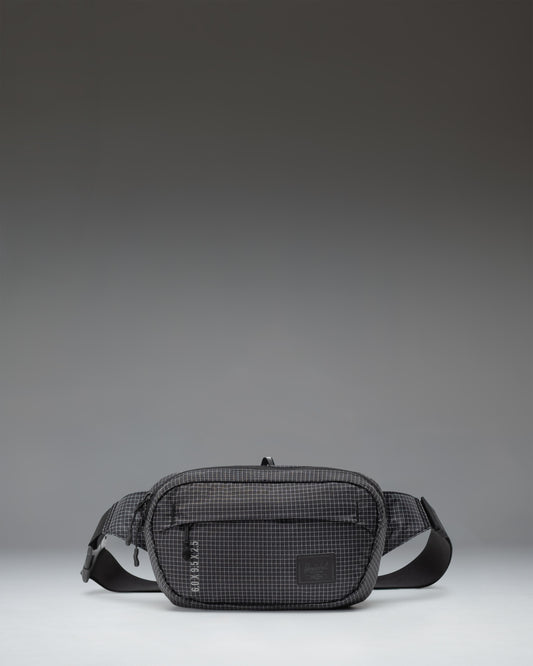 Herschel Supply Co Ultralight Hip Pack 2 L in Black shown from the front highlighting its lightweight design and adjustable strap.