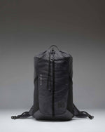 Black Herschel Supply Co Ultralight Cinch Daypack 14 L backpack shown from the front with a drawstring closure and a front zippered pocket.