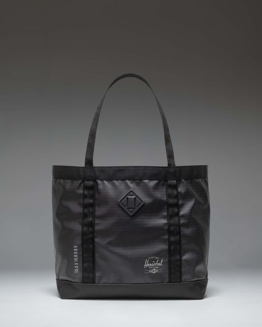 Herschel Supply Co. All Season Gear Tote 33 L in black, showing a lifestyle view of the durable everyday bag.