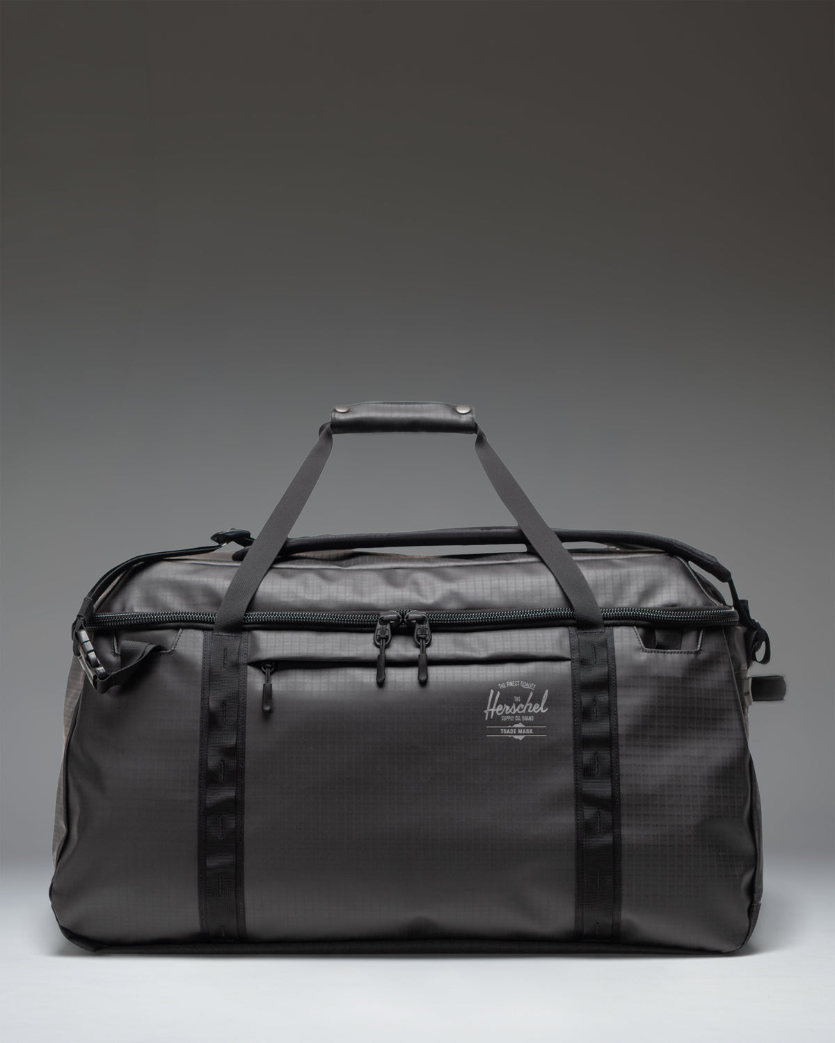 Herschel Supply Co All Season Duffle 66 L in Black, featuring a clean, classic duffle bag design with dual top handles.