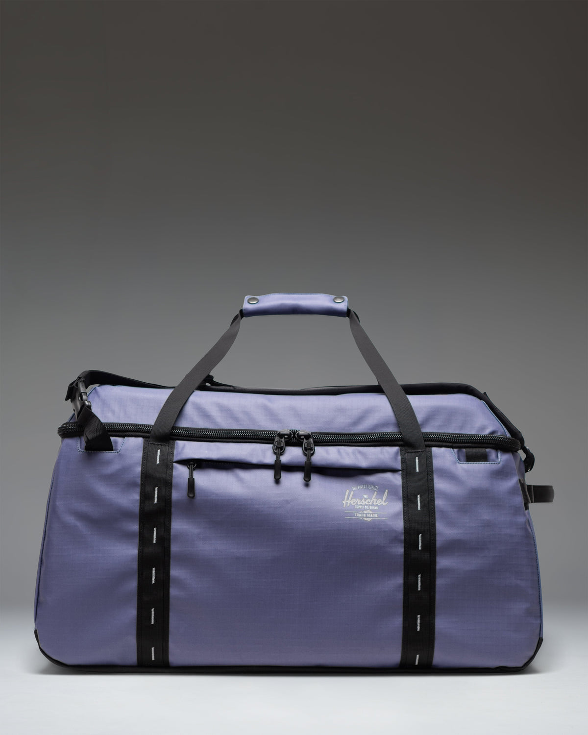 Herschel Supply Co. All Season Duffle 66 L in Heron/Black, showing a spacious main compartment with a zipper closure.