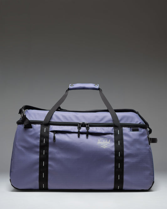 Herschel Supply Co. All Season Duffle 66 L in Heron/Black, showing a spacious main compartment with a zipper closure.