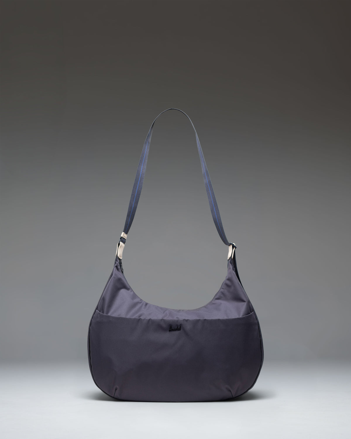 Herschel Supply Co. slouchy Yara Large Shoulder Bag with adjustable webbing strap, zippered front pocket, and metal logo.