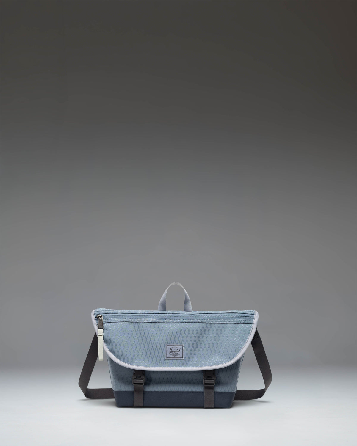 Herschel Supply Co. Cove Small Messenger bag in Blue Mirage Diamond/Sea Storm.