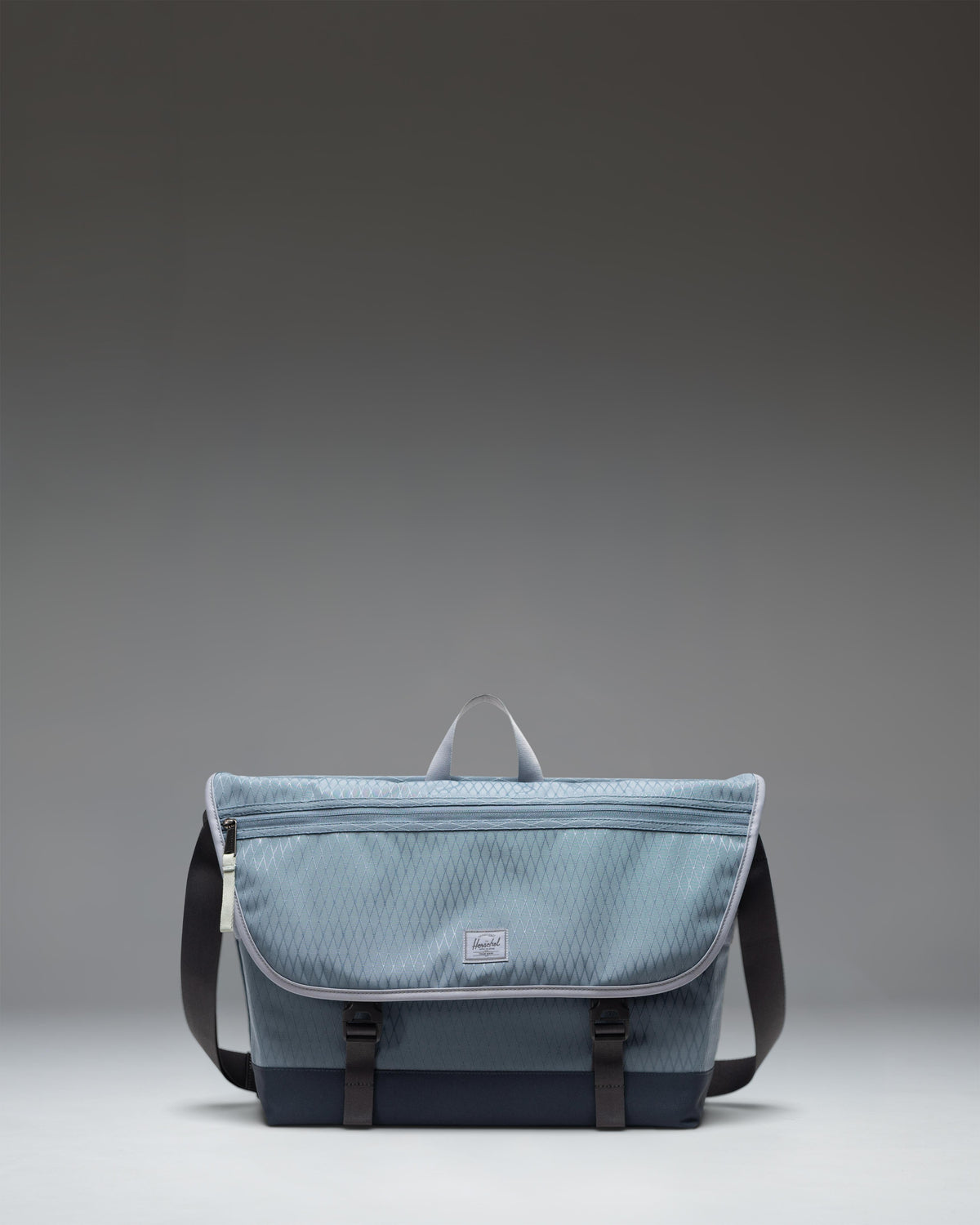 Herschel Supply Co Cove Messenger bag in Blue Mirage Diamond/Sea Storm.