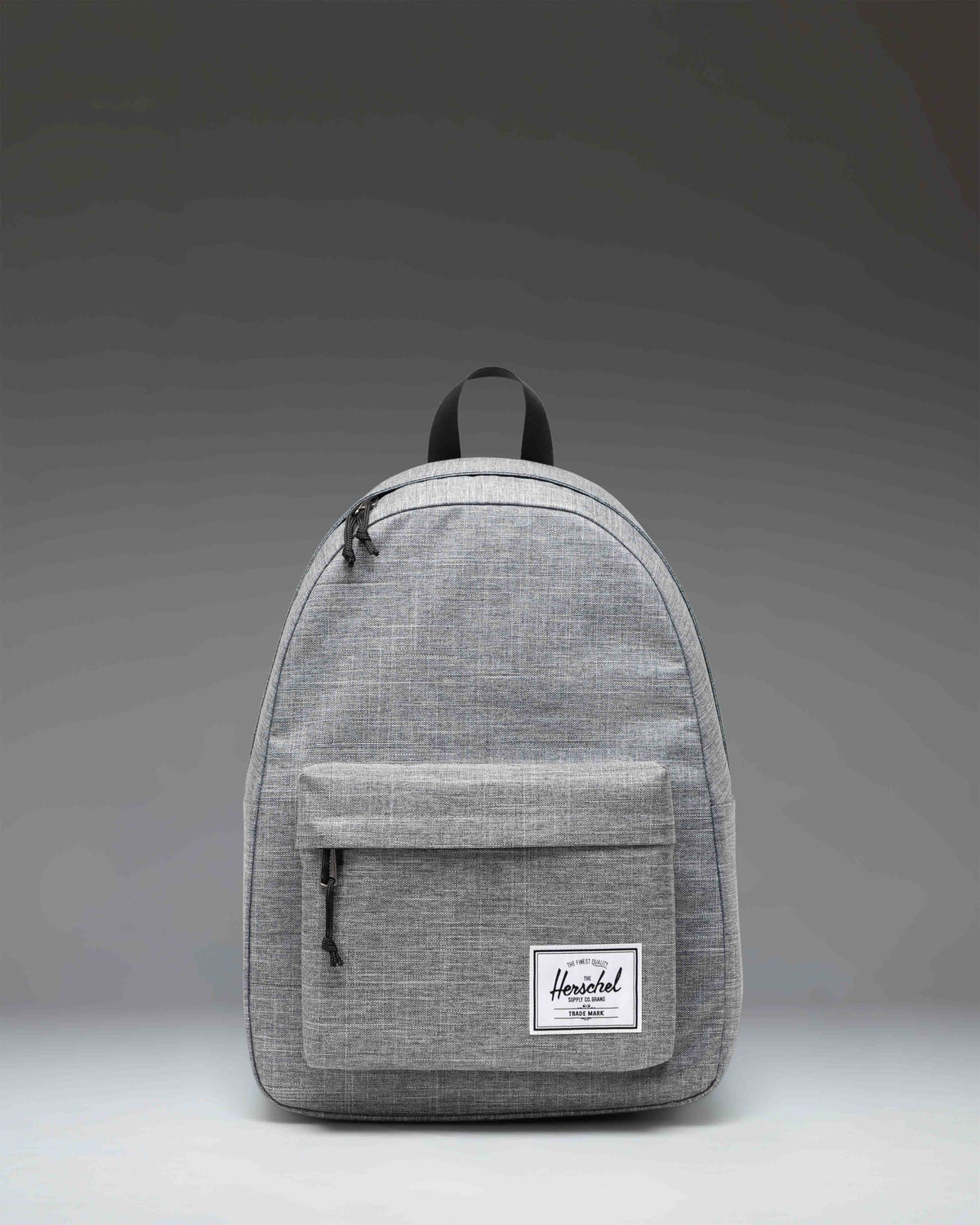 Herschel Classic Backpack in Raven Crosshatch heather grey with a front zippered pocket and signature woven label.