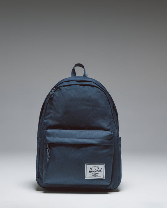 Herschel Classic XL Backpack in navy blue, shown from a front angle against a white background.