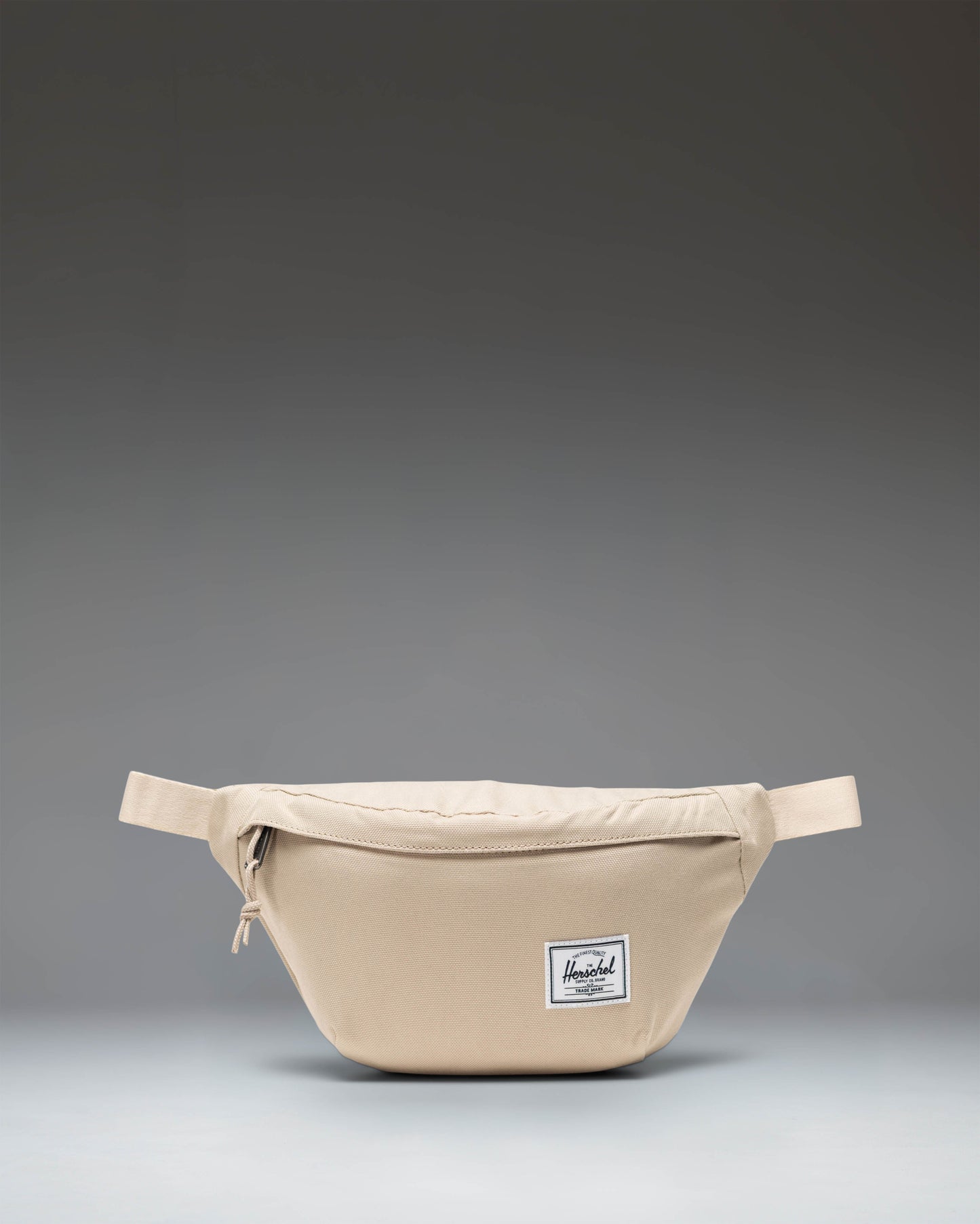 Herschel Classic Hip Pack in Eucalyptus green, showing a compact waist bag with an adjustable strap and front zipper pocket.