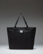 Herschel Classic Tote in Black, featuring a clean, minimalist design with dual top carrying handles.