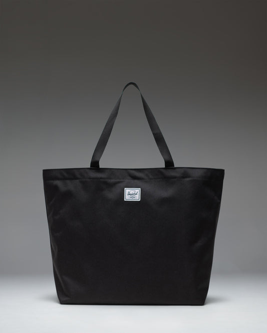 Herschel Classic Tote in Black, featuring a clean, minimalist design with dual top carrying handles.