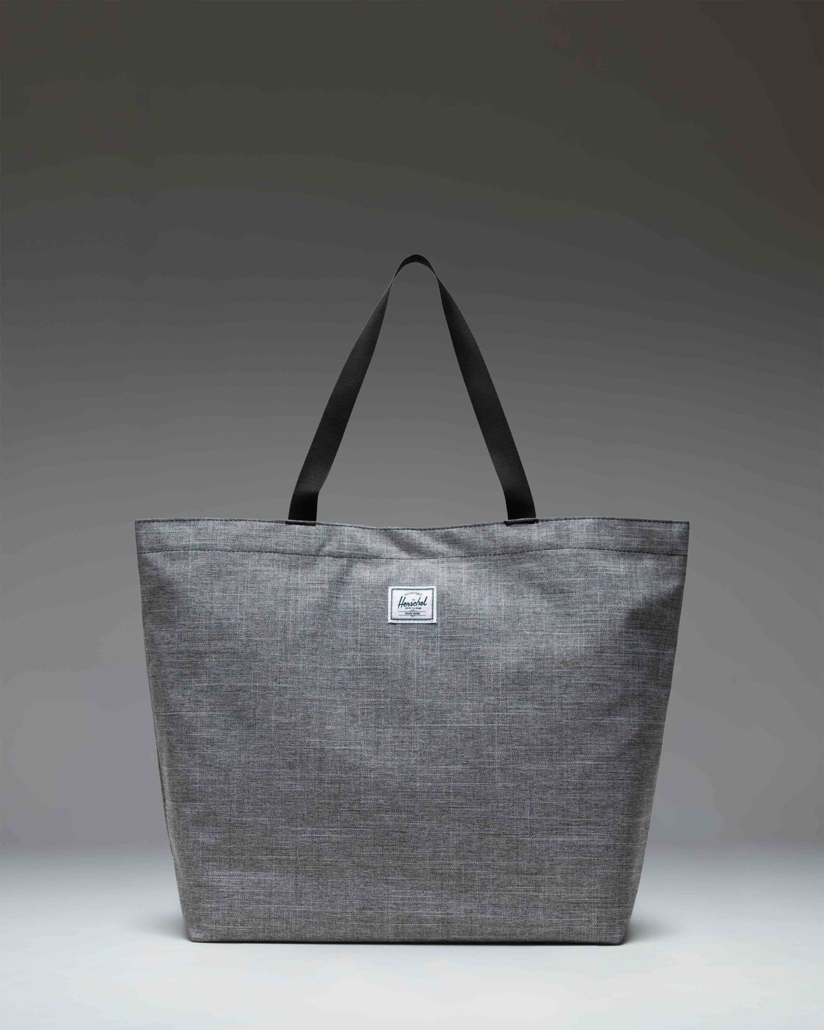 Herschel Classic Tote bag in Raven Crosshatch grey.