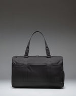 Black Herschel Novel Duffle Tech duffle bag, ideal for travel and tech storage.