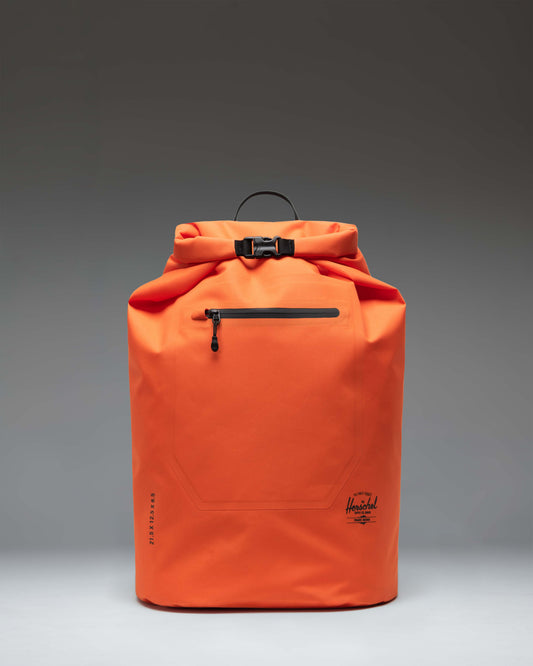 Herschel Supply Co Dry Bag Backpack 32 L in Vermillion Orange, showcasing a roll-top design and durable waterproof material.