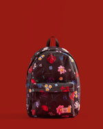Herschel Supply Co. x LEGO Classic XL Backpack in Falling Florals print featuring a black background with vibrant, colorful LEGO brick flowers.