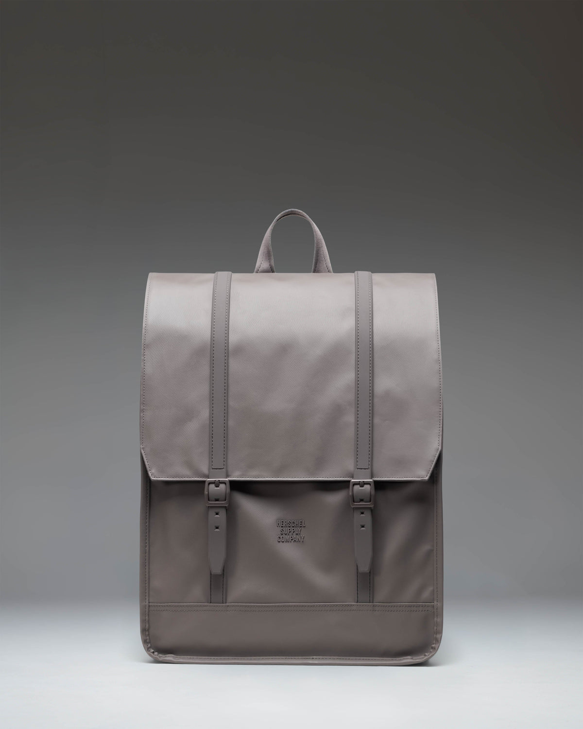 Herschel Survey Backpack in Dark Gull Gray, showing a clean, modern design with dual strap closures, ideal for everyday travel or school.