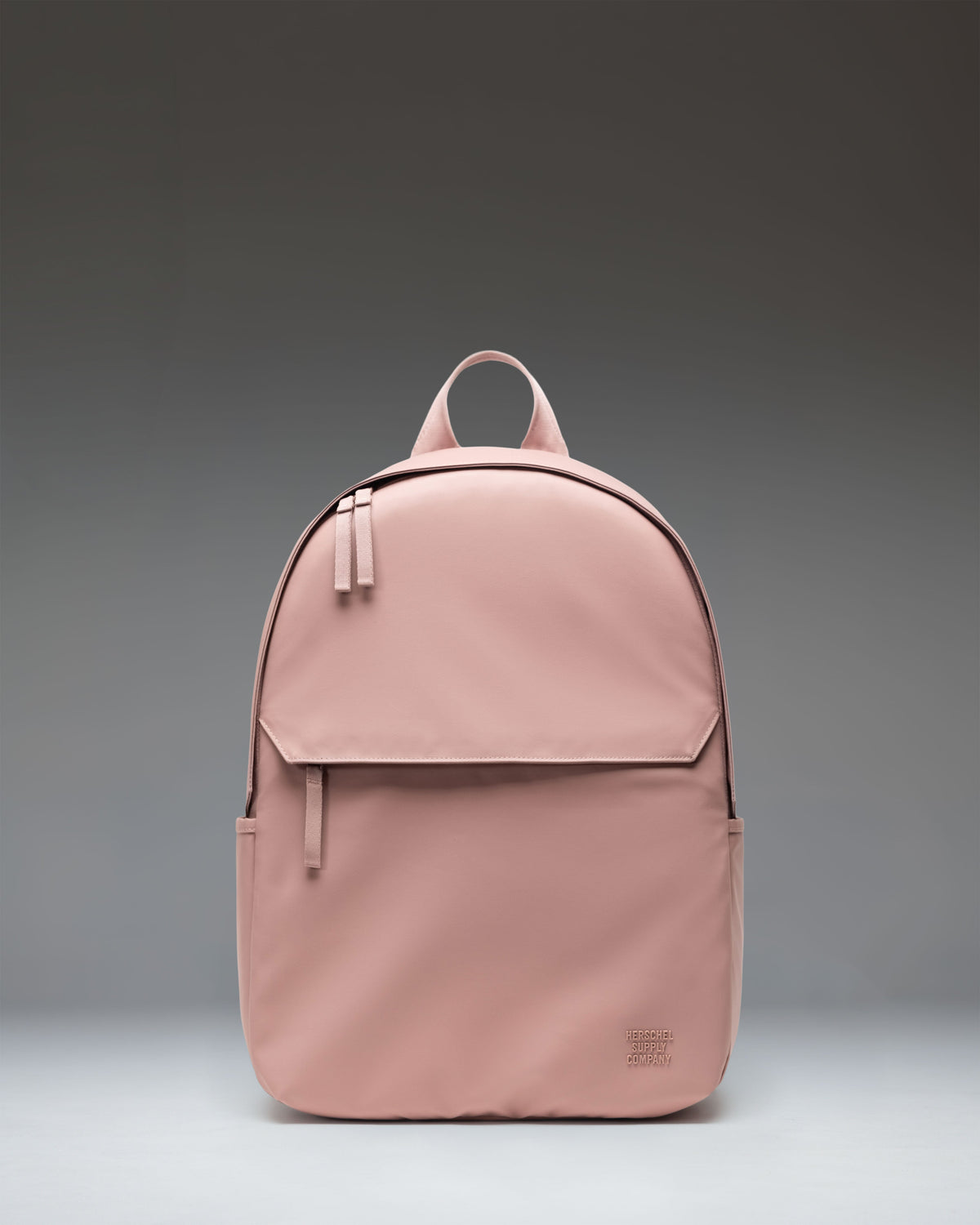 Herschel Supply Co. Alberni Backpack in Ash Rose, a light pink everyday backpack showing the front view with shoulder straps.