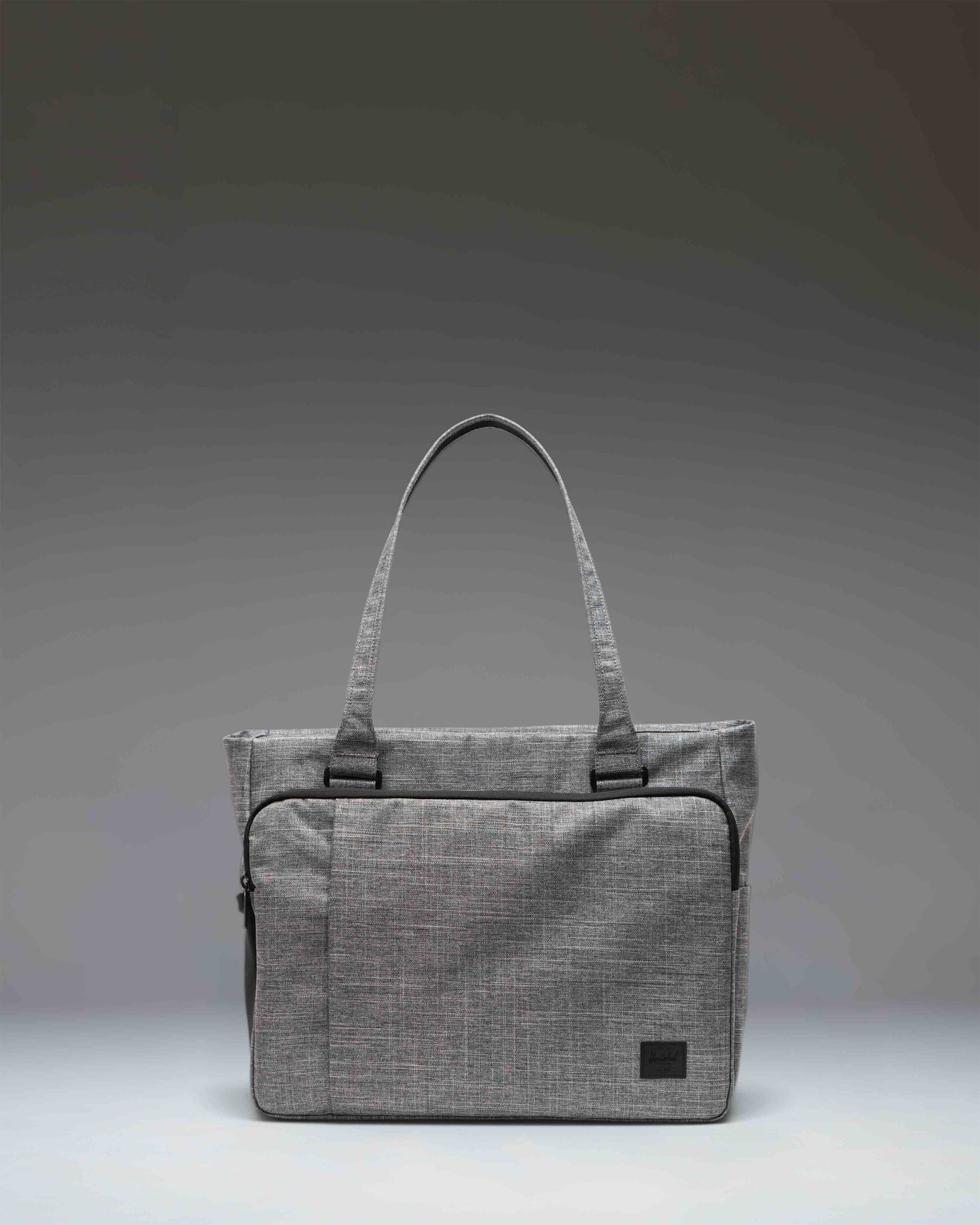 Herschel Supply Co Kaslo Tote Tech in Raven Crosshatch grey, showing the front view with dual top handles and a clean, rectangular design.