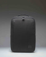 Herschel Supply Co. Kaslo Travel Backpack Tech in black. Clean front view showcasing the durable material and zippered compartments.