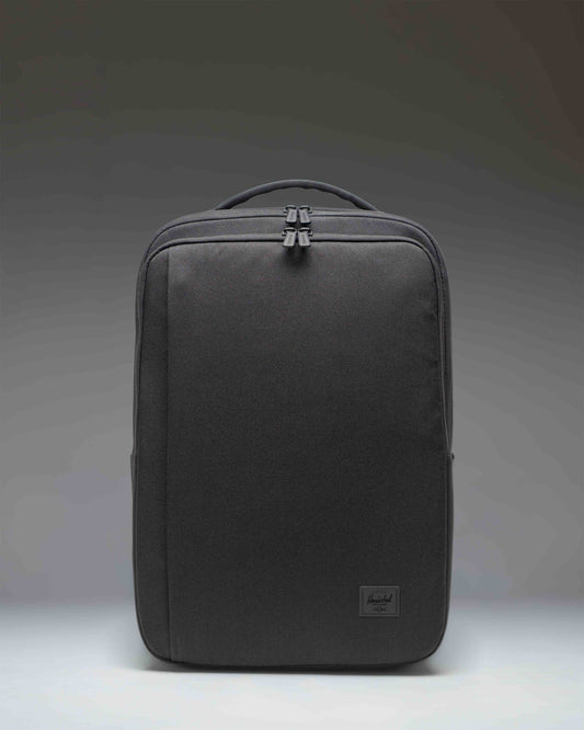 Herschel Supply Co. Kaslo Travel Backpack Tech in black. Clean front view showcasing the durable material and zippered compartments.