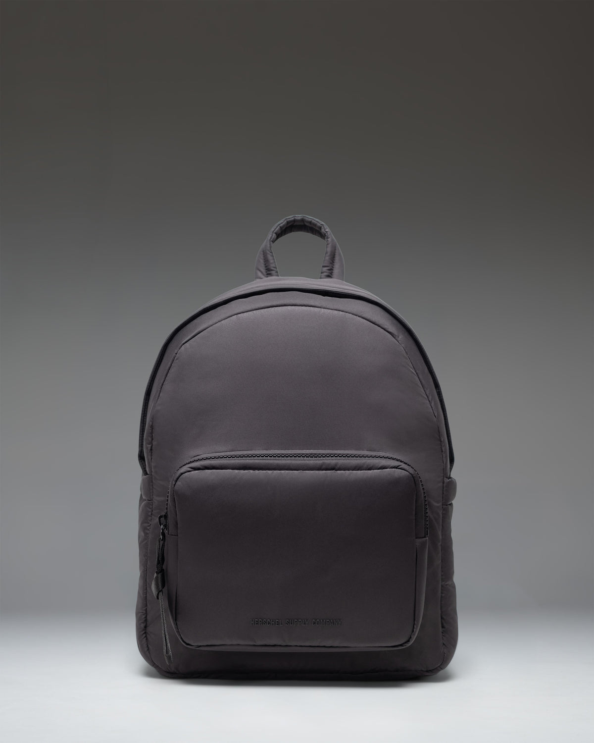 Herschel Supply Co. Cloudform Backpack in black, shown from the front, highlighting its clean design and durable construction.