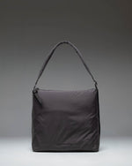 Herschel Supply Co Cloudform Tote in black, showcasing a clean, minimalist design with dual top handles and a spacious main compartment.