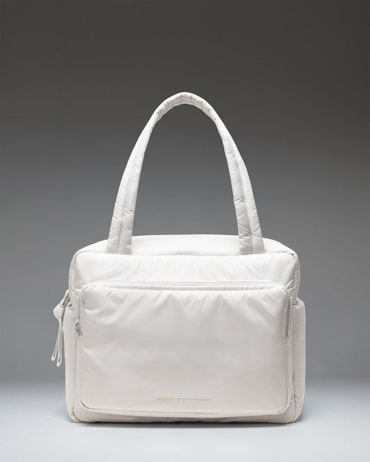 Herschel Supply Co. Cloudform Duffle Bag in Metal colorway. Lightweight, minimalist design with padded fabric, dual top handles, and logo detail.