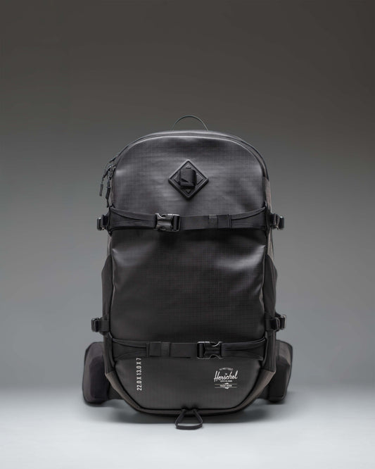 Black Herschel Supply Co. All Season Pro Backpack 36L shown from the front, highlighting its clean, functional design.